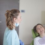 dentist and patient laughing