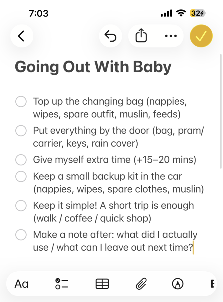 a note on phone with reminders for going out with a baby